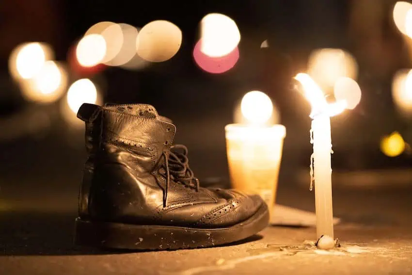 A boot next to a candle at a vigil for Mexico's disappeared