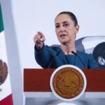 President Claudia Sheinbaum taking a question from a reporter during her daily press conference in the National Palace in Mexico City.