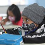 A child wearing a face mask at school