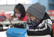 A child wearing a face mask at school