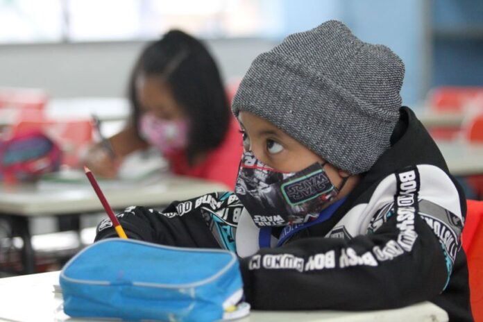 A child wearing a face mask at school