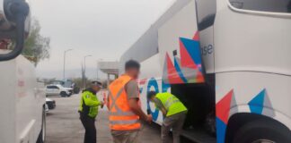 Authorities inspecting bus cargo hold