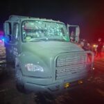 A bullet-riddled National Guard vehicle