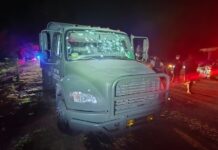 A bullet-riddled National Guard vehicle