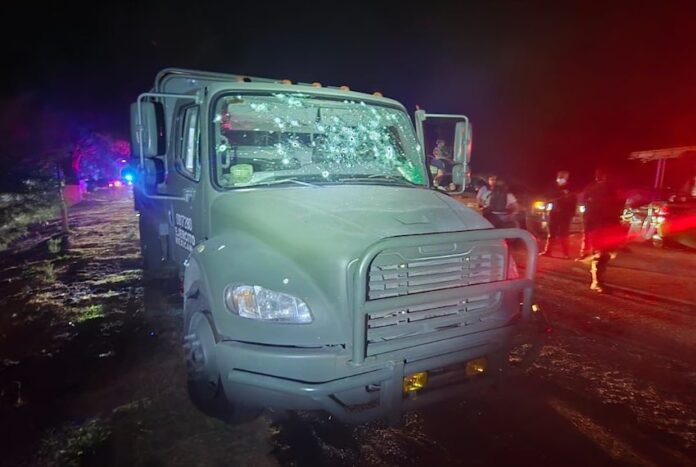 A bullet-riddled National Guard vehicle