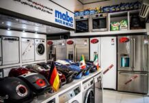 A store sign reading "Mabe: Made in Mexico" surrounded by refrigerators, stoves and other appliances