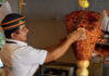 A man making tacos al pastor