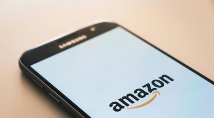 A cell phone displaying the amazon logo