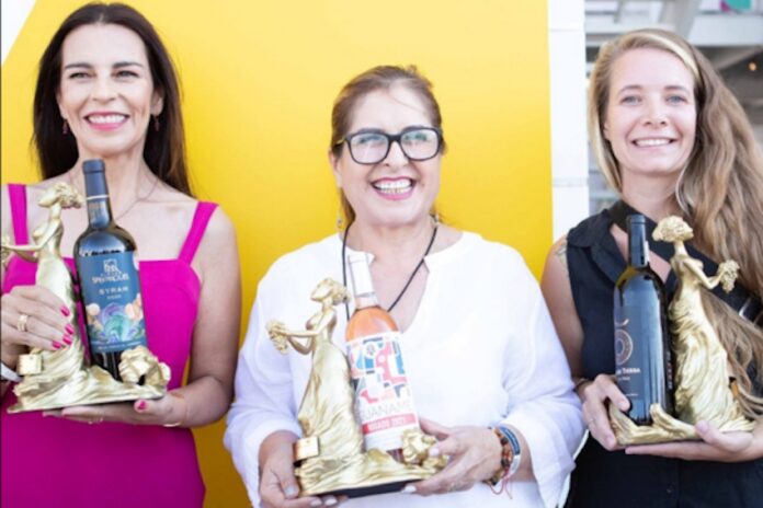 A group of female winemakers in Baja California displaying their awards