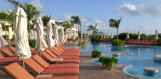 A line of pool chairs at Moon Palace in Cancún, a property belonging to Palace Resorts, the timeshare company involved in the fraud dispute