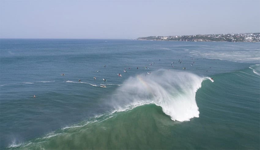 Surfers line up as a big swell rolls into Playa Zicatela in Puerto Escondido