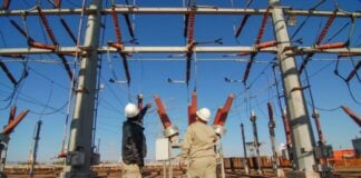 Construction workers at an electrical station.