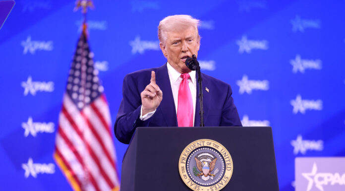 Trump stands at podium shaking his finger