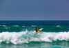 A surfer performs a trick in a wave at Zicatela Beach in Puerto Escondido, the 14th World Surfing Reserve