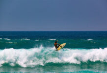 A surfer performs a trick in a wave at Zicatela Beach in Puerto Escondido, the 14th World Surfing Reserve