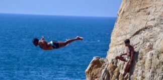A diver jumps from La Quebrada cliffs in Acapulco