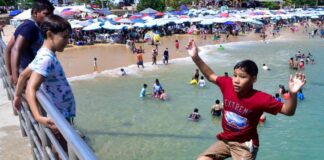 Tourists at a beach in Acapulco, Mexico