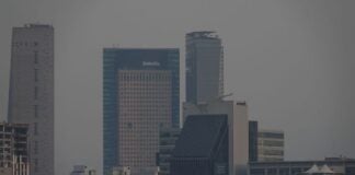 A polluted Mexico City skyline with smog hampering visibility