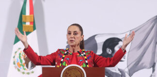 President Claudia Sheinbaum gestures from behind the podium at her morning press conference