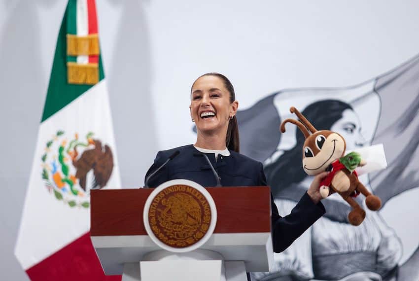 President Sheinbaum with a stuffed "Cri Cri," the singing Mexican cricket. 