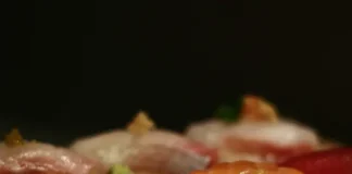 A selection of sashimi sushi on a wooden board