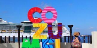 Cozumel sign with cruise ship behind
