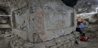 A huge square masonry block is visible in an underground tunnel, as archaeologists excavate the ancient Teotihucán found in Guatemala
