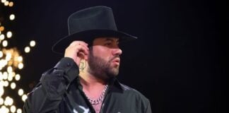 Luis R. Conriquez in black shirt and cowboy hat