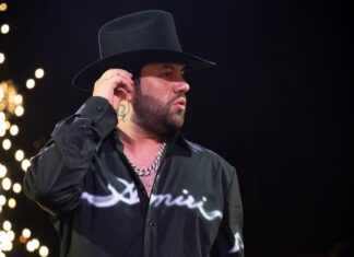 Luis R. Conriquez in black shirt and cowboy hat