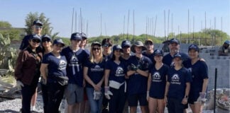 A group of teenagers pose for a photo