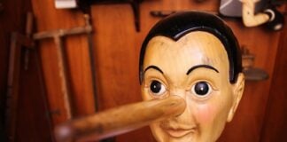 A wooden statue of Pinocchio