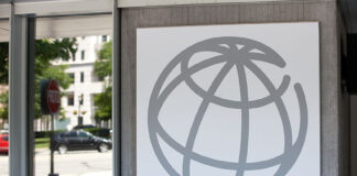 The World Bank globe logo on a grey building
