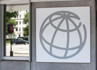 The World Bank globe logo on a grey building