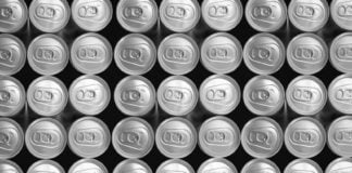 A close up of the lids of aluminum beer cans