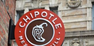 A round sign reading "Chipotle Mexican Grill" with an illustration of a chile