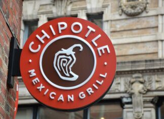 A round sign reading "Chipotle Mexican Grill" with an illustration of a chile