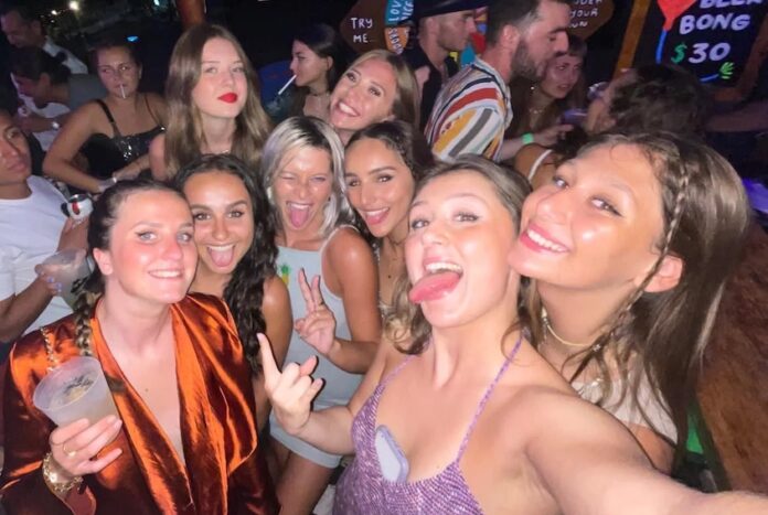 A group of girls at a bar in Tulum