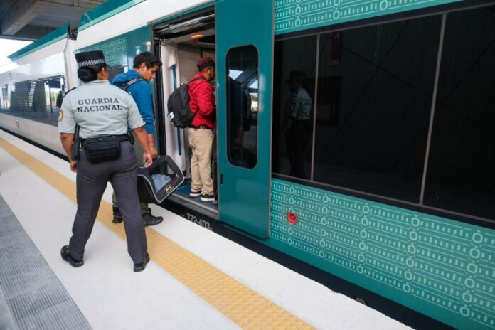Passengers boarding a Maya Train car