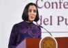 Luz Elena González speaking at podium