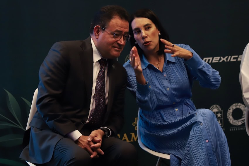 man and woman seated and talking