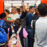 Riders pack into a metro car