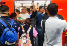 Riders pack into a metro car