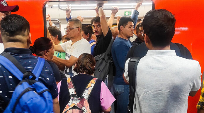 Riders pack into a metro car