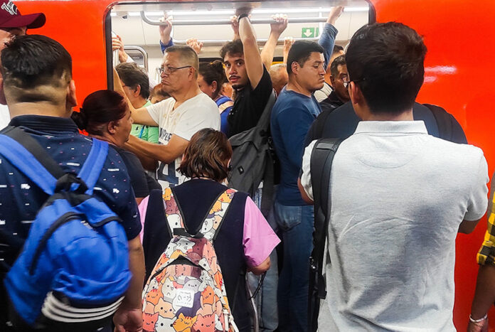 Riders pack into a metro car