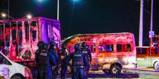 A burnt out bus as part of a narcoblocade