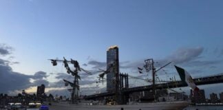Damaged ship by a bridge