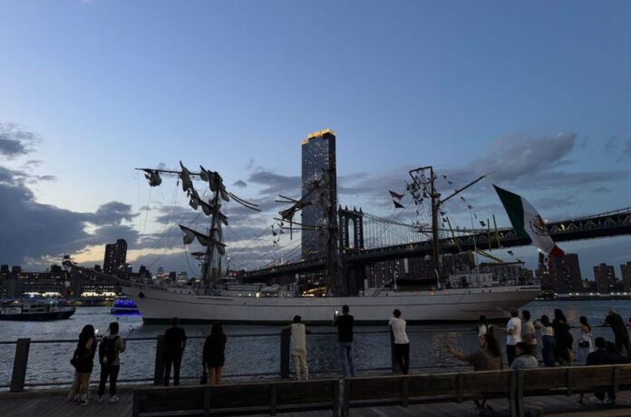 Damaged ship by a bridge