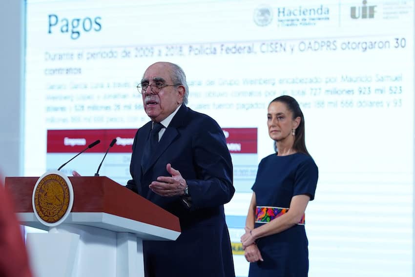 Man at podium with president behind him