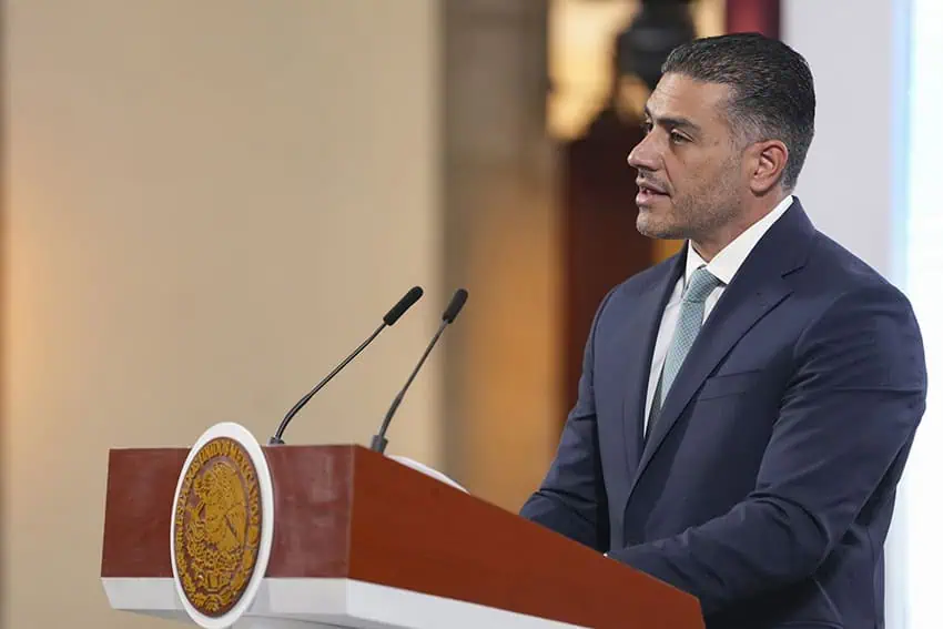 Defense Minister Garcia Harbuch speaks on a platform