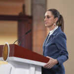 President Sheinbaum at her press conference podium